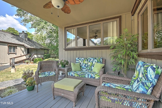 deck featuring ceiling fan and outdoor lounge area