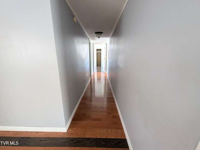 corridor featuring dark wood-type flooring