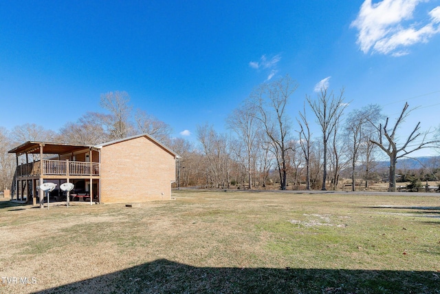 view of yard with a wooden deck