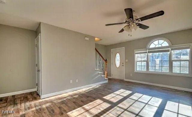 foyer entrance featuring ceiling fan and dark hardwood / wood-style floors