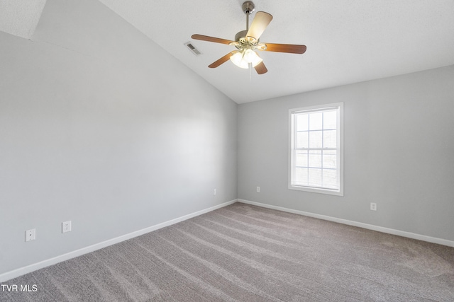 unfurnished room featuring ceiling fan, carpet, and lofted ceiling