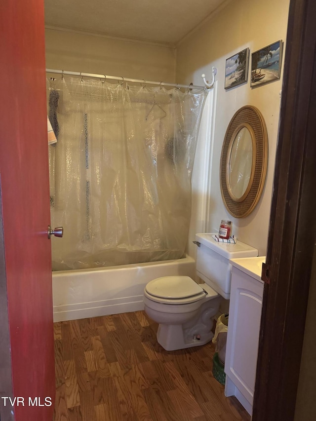 full bathroom with vanity, hardwood / wood-style floors, shower / tub combo, and toilet