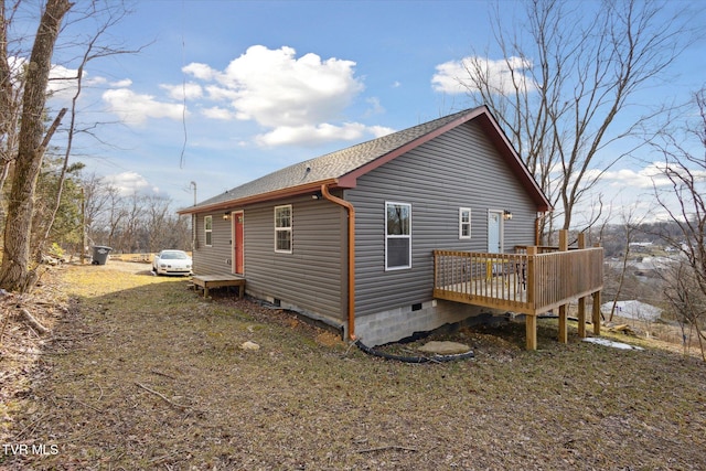 view of property exterior with a deck