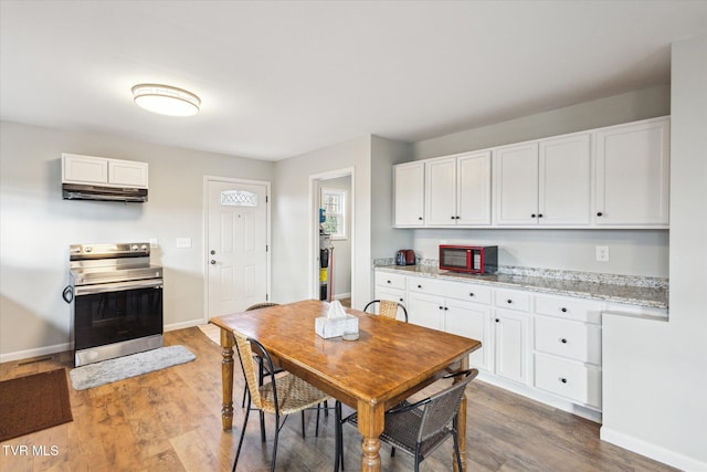 dining area featuring hardwood / wood-style flooring