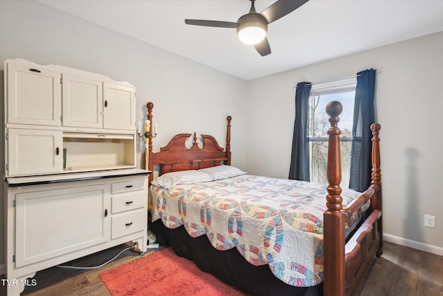 bedroom featuring ceiling fan and dark hardwood / wood-style floors