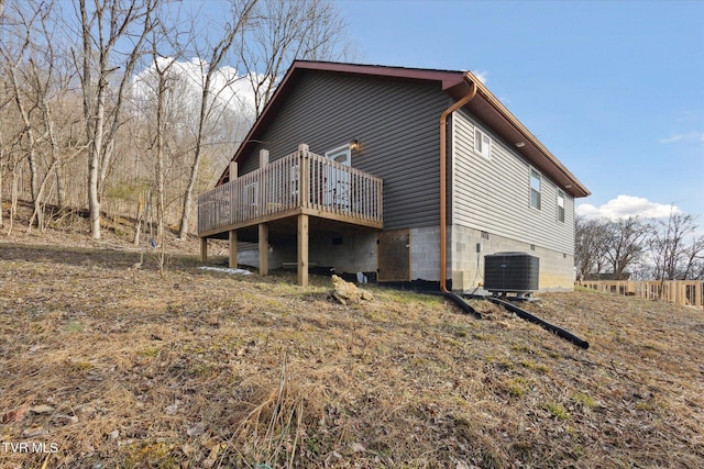 exterior space with cooling unit and a deck