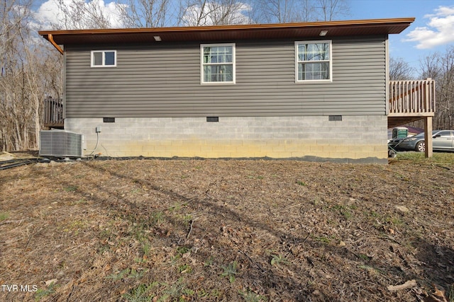 view of home's exterior with central AC