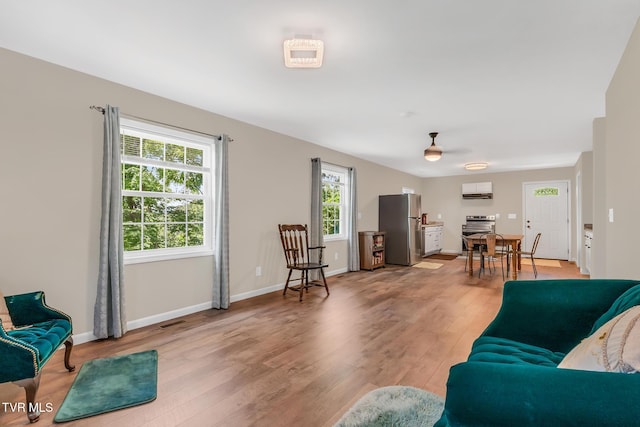 living room with light hardwood / wood-style flooring