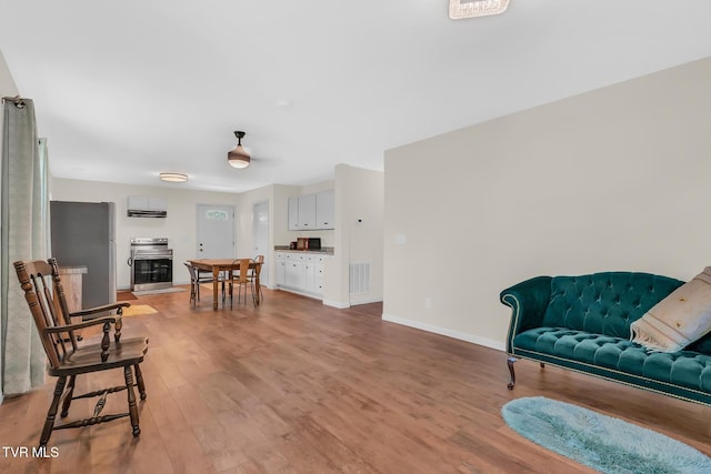 sitting room featuring light hardwood / wood-style flooring