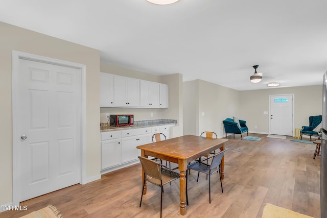 dining room featuring light hardwood / wood-style floors