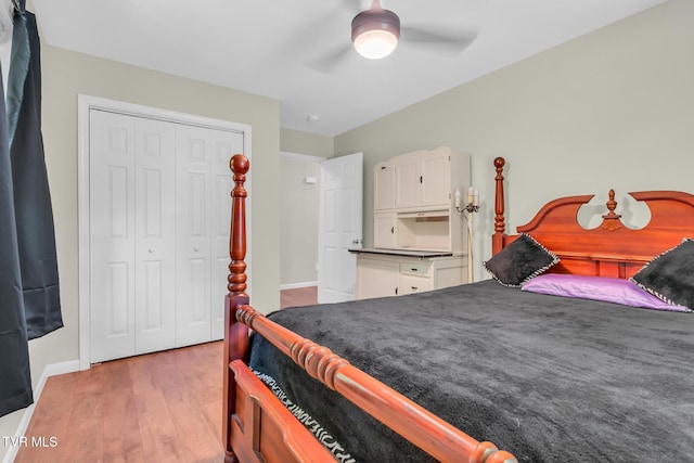 bedroom with ceiling fan, a closet, and light wood-type flooring