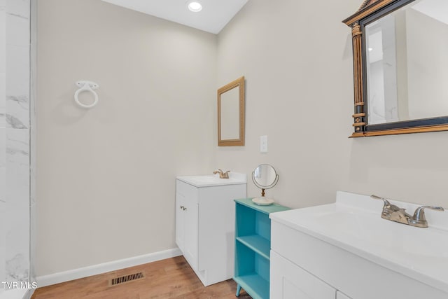 bathroom with wood-type flooring and vanity