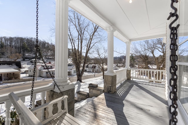 view of snow covered deck