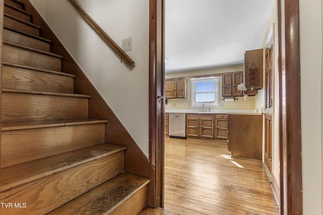 stairs with hardwood / wood-style floors