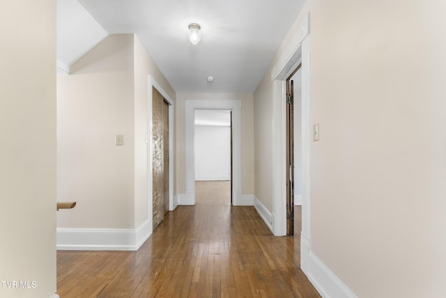 hall with hardwood / wood-style floors