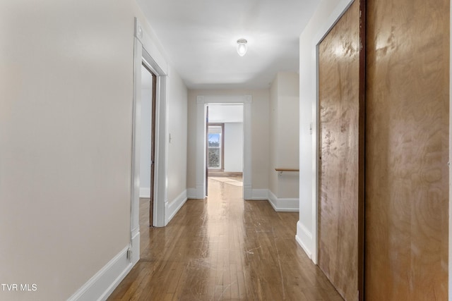 corridor with light wood-type flooring