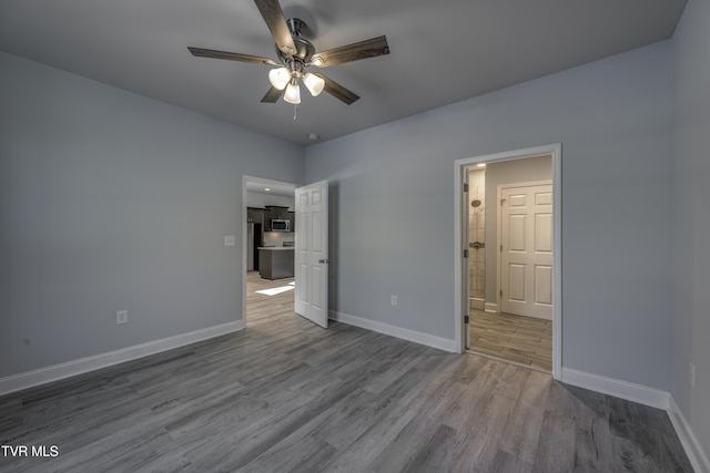 unfurnished bedroom with hardwood / wood-style flooring and ceiling fan