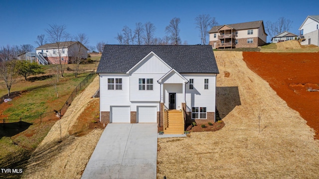 101 Lorena Ln, Jonesborough, TN 37659 - raised ranch with fence, roof with shingles, concrete driveway, a garage, and brick siding