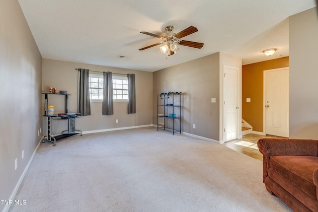 interior space featuring a textured ceiling and ceiling fan