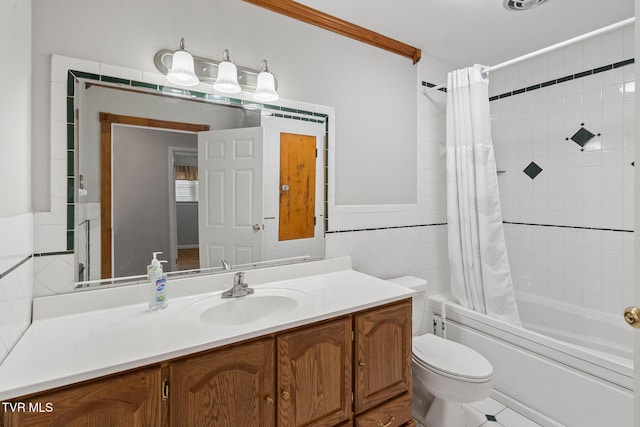 full bathroom with vanity, tile walls, toilet, crown molding, and shower / bath combo