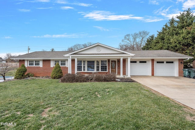 ranch-style house featuring a front lawn and a garage