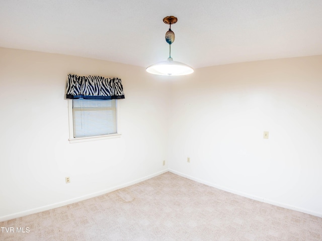 unfurnished room featuring carpet