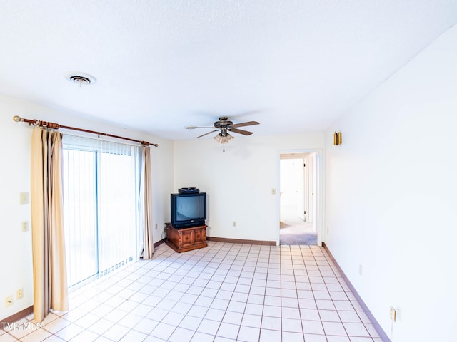 unfurnished living room featuring ceiling fan