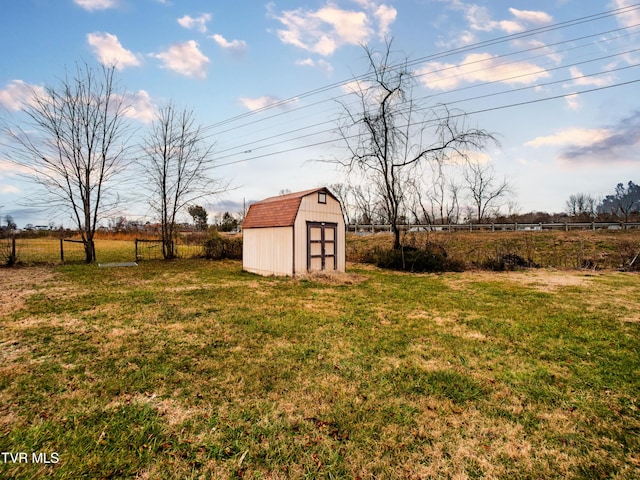 view of yard with a rural view and a storage unit