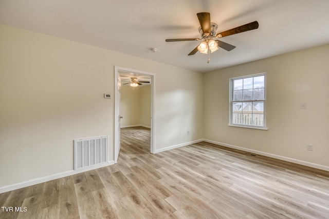 empty room with ceiling fan and light wood-type flooring