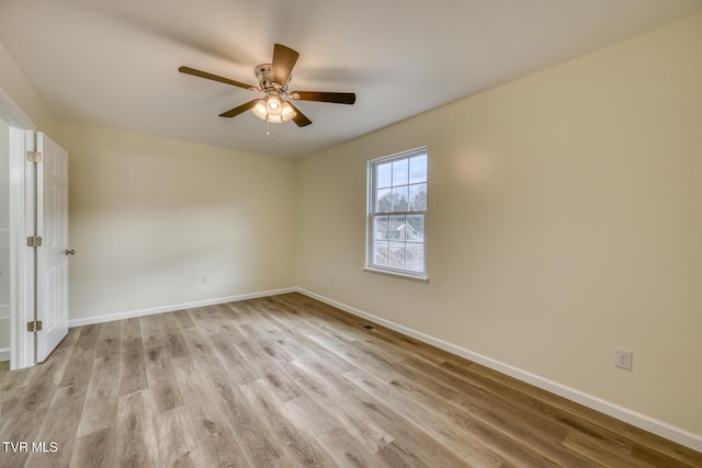 spare room with ceiling fan and light hardwood / wood-style floors