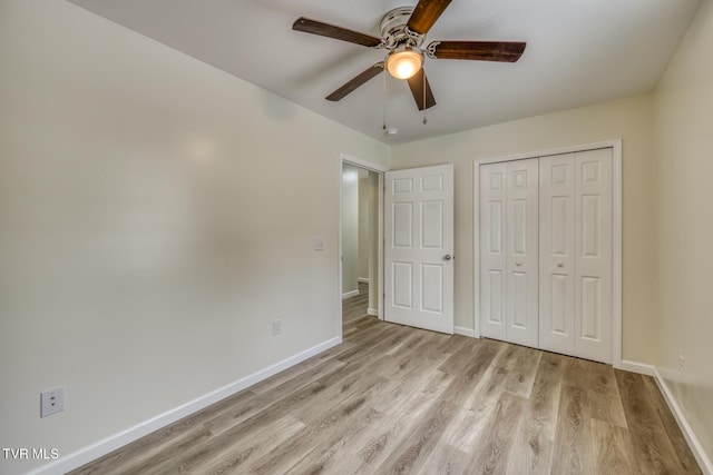 unfurnished bedroom with ceiling fan, a closet, and light hardwood / wood-style floors