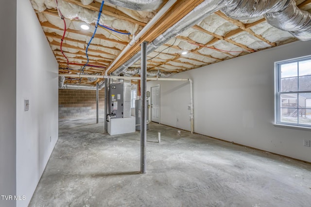 basement with heating unit and water heater