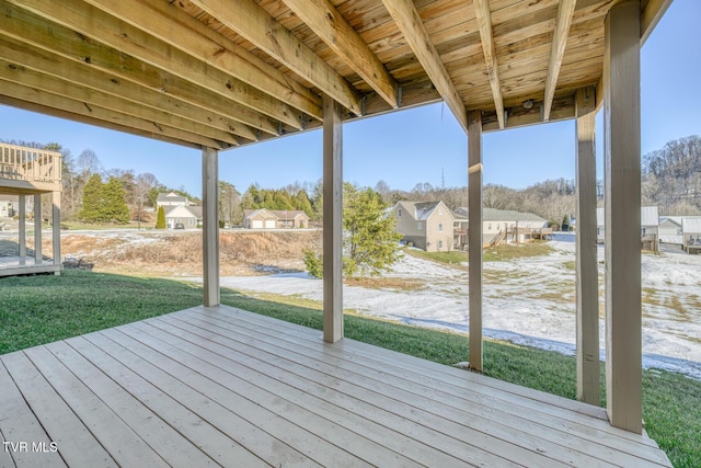 wooden terrace with a yard