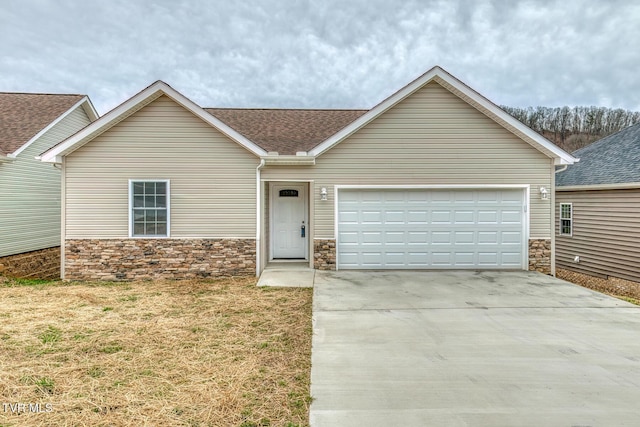 single story home featuring stone siding, concrete driveway, a garage, and a shingled roof