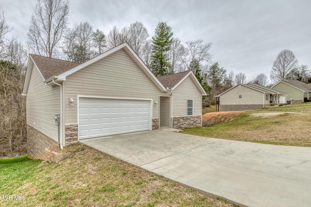 single story home featuring driveway, stone siding, a shingled roof, a front yard, and an attached garage