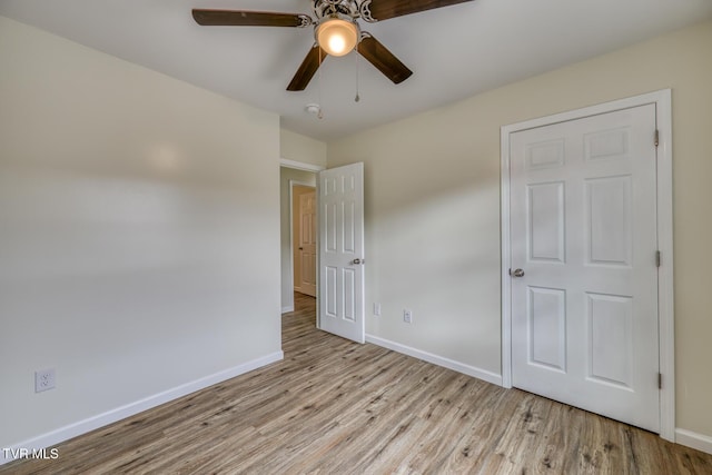 unfurnished bedroom featuring ceiling fan and light hardwood / wood-style flooring