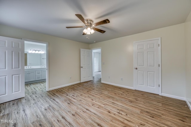 empty room with light hardwood / wood-style floors, sink, and ceiling fan