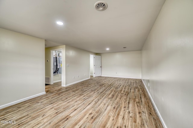 empty room with light hardwood / wood-style floors