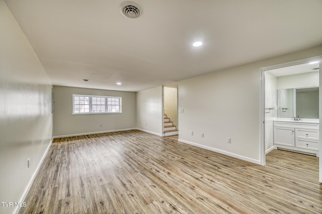 spare room with light hardwood / wood-style flooring