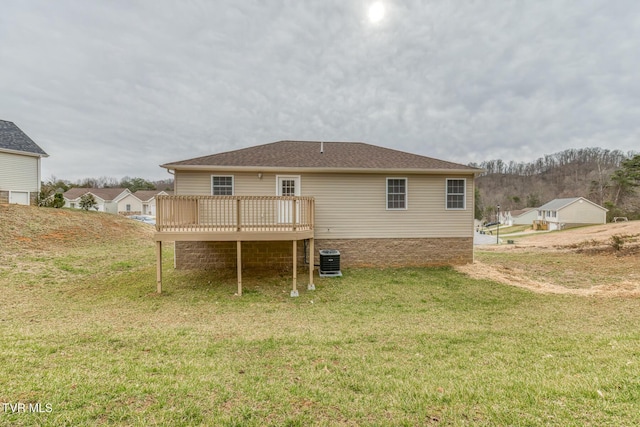 back of house with a yard, central AC, and a wooden deck