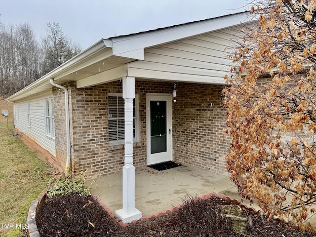 property entrance with a patio