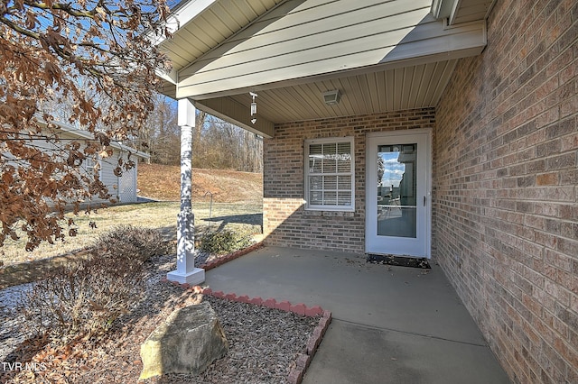 property entrance with a patio