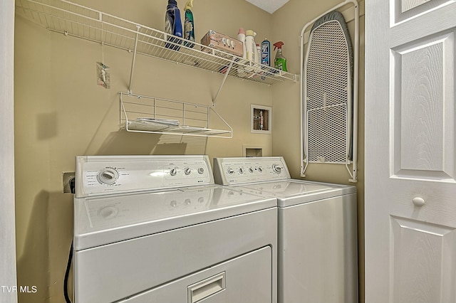 laundry room featuring separate washer and dryer