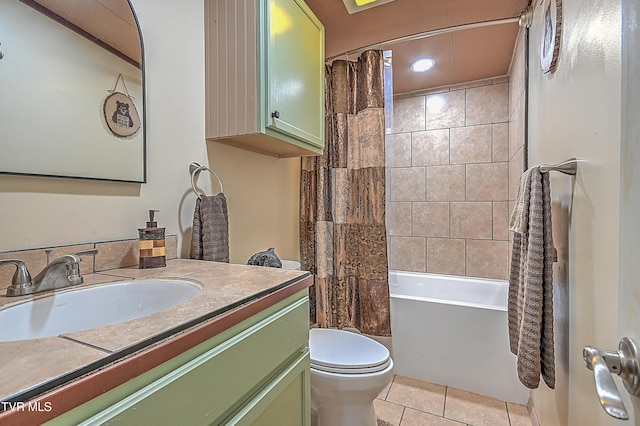 full bathroom featuring tile patterned flooring, shower / bath combo, vanity, and toilet