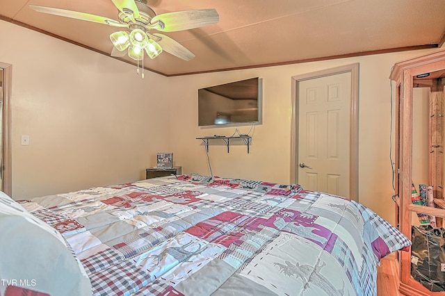 bedroom featuring ornamental molding and ceiling fan