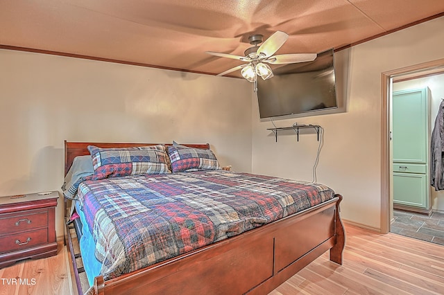 bedroom featuring light hardwood / wood-style floors and ceiling fan