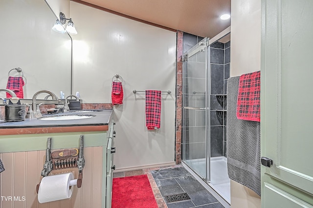 bathroom with vanity, a shower with shower door, and tile patterned flooring