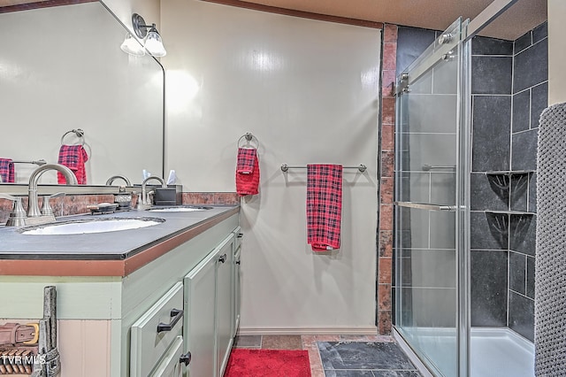 bathroom with walk in shower and vanity