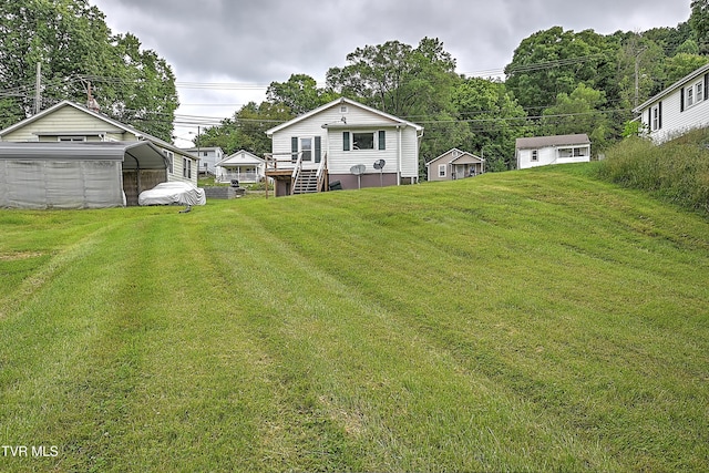 view of yard with an outdoor structure and a carport