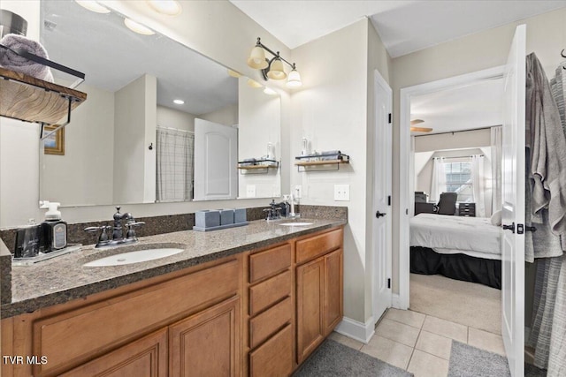 bathroom featuring ceiling fan, vanity, and tile patterned flooring